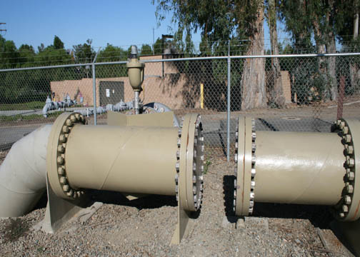The pipe piece on the right is the old Irvine Lake Pipeline, which is capped off. The piece on the left is the new pipe that serves recycled water to the agricultural customers.